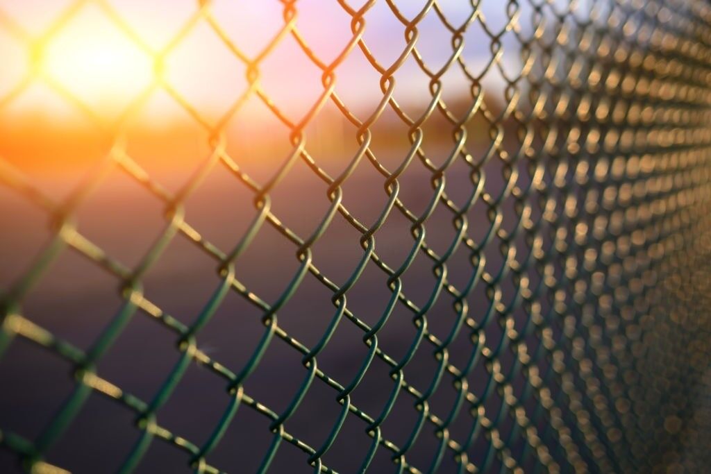 fence with metal grid in perspective, background Telfence panel çit fiyatları, çim çit fiyatları, tel örgü fiyatları